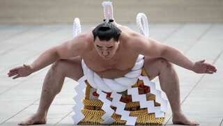 Japanese police question sumo star over alleged beer bottle assault