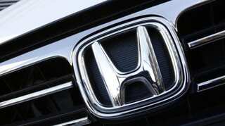 Honda cuts profit, sales outlook to four-year low; unveils $915 million buyback