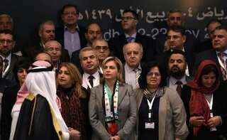 Syrian opposition agrees to send united delegation to Geneva talks