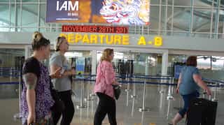 Flights resume as Bali's volcano-hit airport reopens