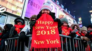 In frigid Times Square, relief arrives with New Year