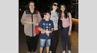 Airport celeb spotting: Karisma Kapoor with kids and mother Babita