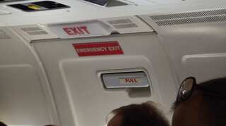 Tired of waiting, Ryanair passenger gets out and sits on wing