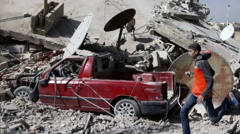 France urges halt to air strikes, aid corridors in Syria