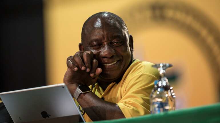 South Africa's Ramaphosa cuts short Britain trip to deal with protests at home