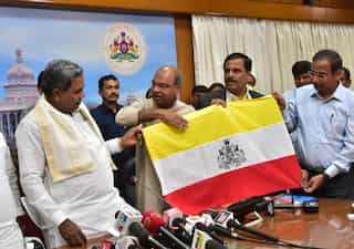Karnataka unveils state flag, to seek approval from Centre