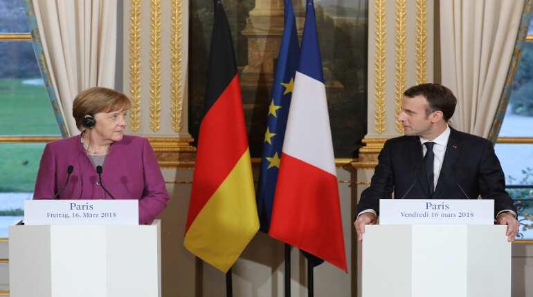 Merkel, Macron plan roadmap by June on euro zone reform