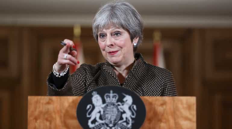 After Syria strikes, UK's Theresa May to face critical parliament