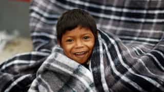 Eight women, children from Central American 'caravan' first to enter US