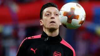 Mesut Ozil out with a back injury but expects to be fit for World Cup