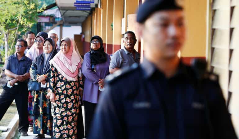 Malaysian politicians claim tech sabotage as polling begins
