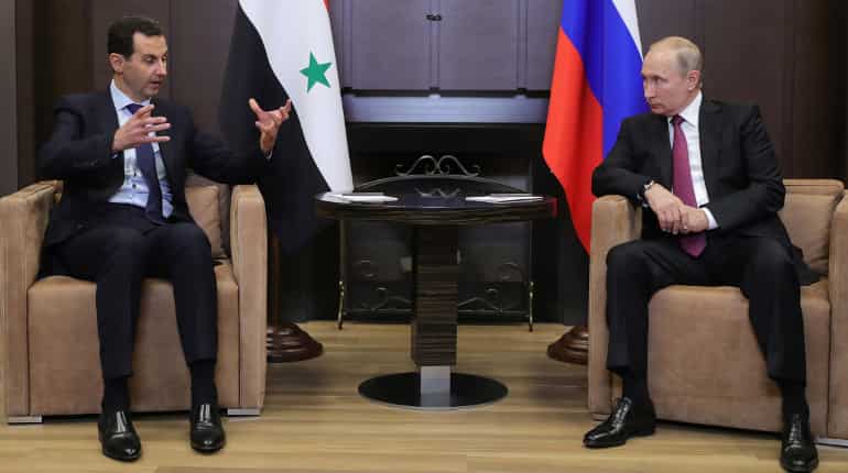 Putin hints at pulling out foreign armed forces from Syria