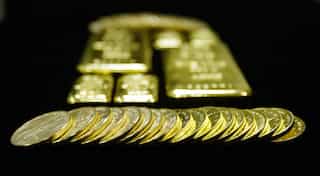 Gold falls from two-year high as Brexit campaign suspended