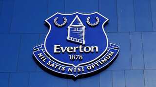 Everton fan holding toddler jailed for brawling