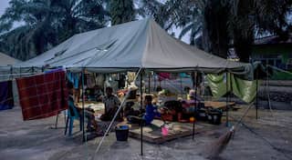 Migrants in Indonesia stranded for days on boat finally brought ashore