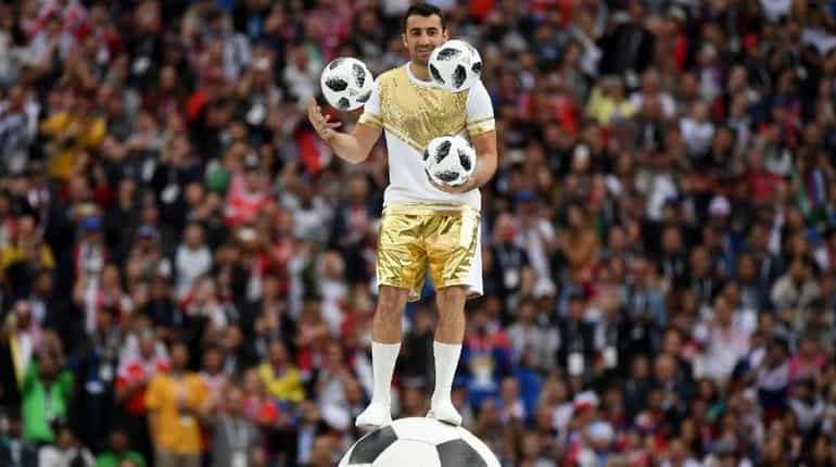 Juggler juggles football