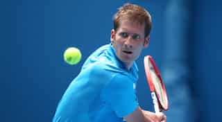 Mayer puts injury struggles behind him to win Halle title