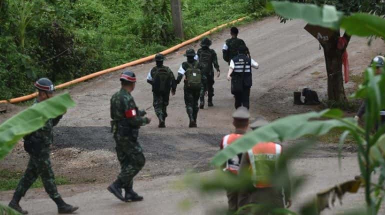 Four boys exit Thailand cave; rescue of others paused for at least 10 hours Four boys exit Thailand cave; rescue of others paused for at least 10 hours