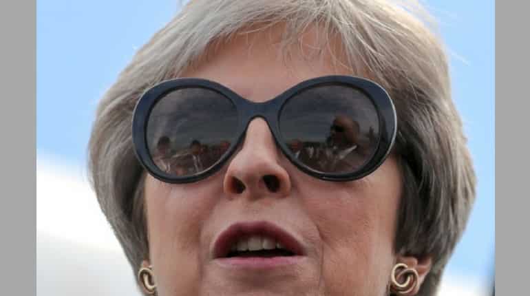 Britain's Theresa May, a survivor under constant pressure