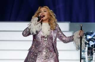 Madonna world tour is on as singer performs in London wearing knee supports post injury