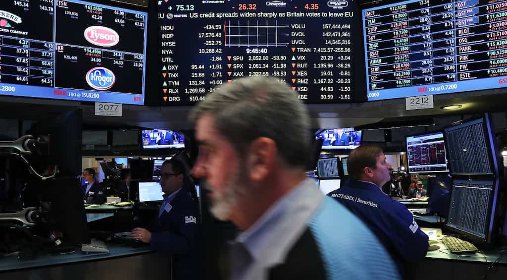 S&P 500 hits 3,000 for the first time as Fed signals possible rate cut