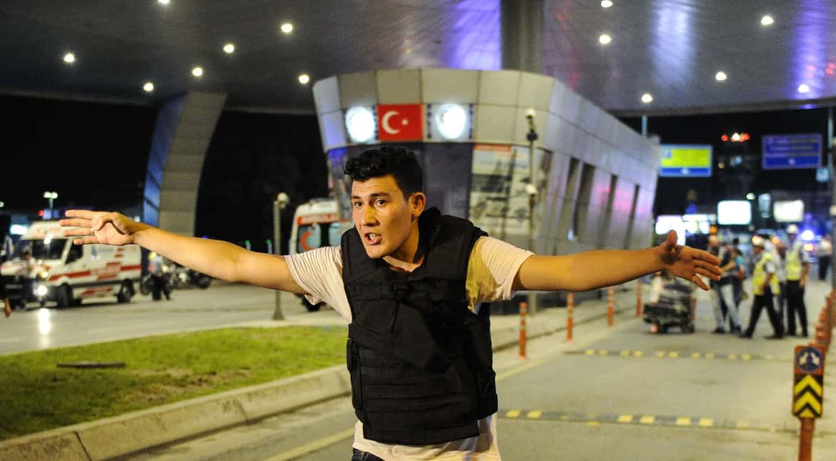 A Turkish police officer secures the entrance of Turkey's largest airport following yesterday's suicide attacks on June 29, 2016, that killed 41 and left more than 239 injured.?