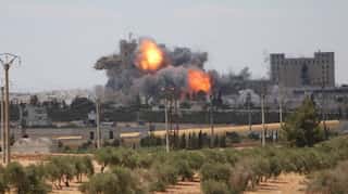 At least 30 killed in Syrian air strikes in Damascas suburb