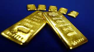 Gold retreats from near two-year high, correction seen short-term