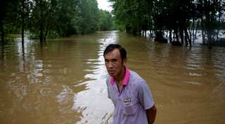 Heavy rains in China leave 128 dead