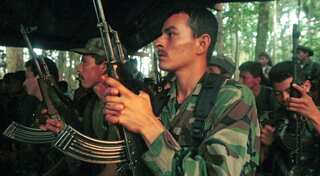 'Last chance' Santos tells rebels unwilling to disarm under peace deal