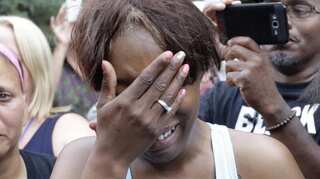 Fiancee of black man slain by police says she was handcuffed after shooting