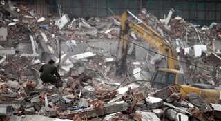 Home forcibly demolished, man in China digs dead mother out from rubble