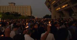 Candlelight vigil honours police officers gunned down in Dallas ambush