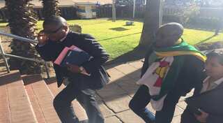 Anti-Mugabe protesters to face 'full wrath' of Zimbabwe law