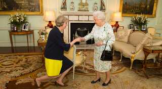 Theresa May curtsies before Queen, arises Britain's Prime Minister