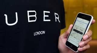 Uber drivers entitled to minimum wage, holiday pay, rules UK tribunal