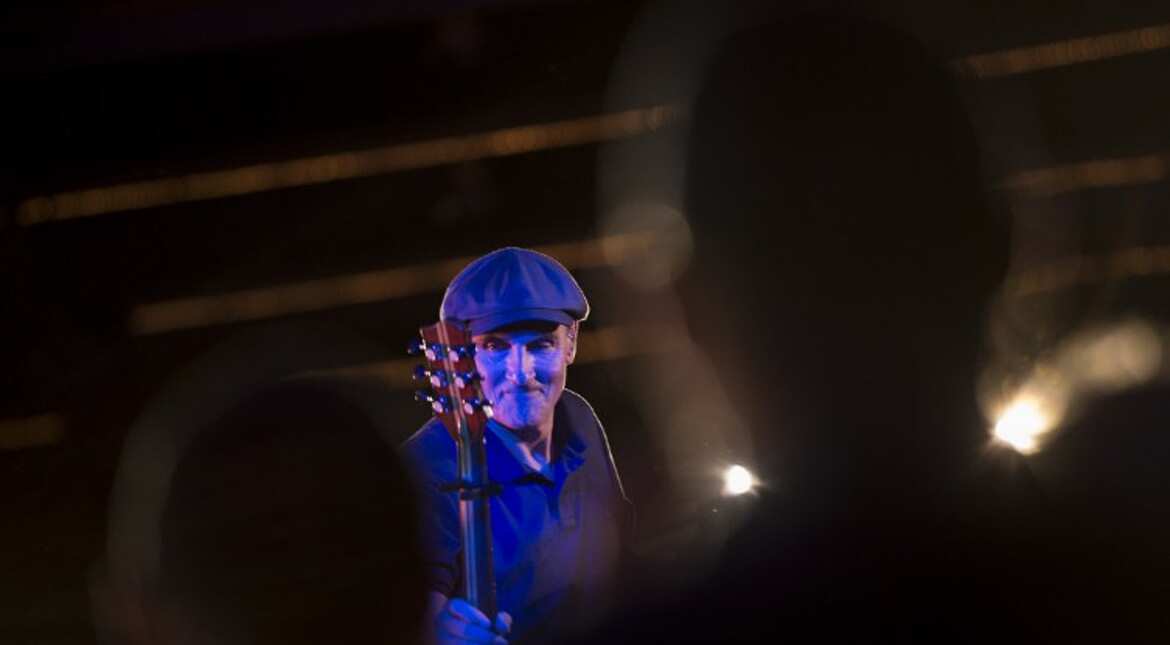 American singer James Taylor performs at Hillary Clinton's rally in Manchester, New Hampshire.