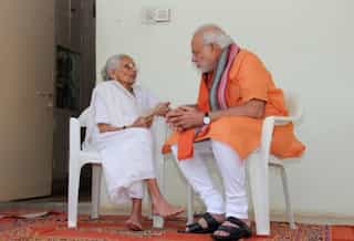 Indian Prime Minister Narendra Modi's mother goes to bank to exchange notes