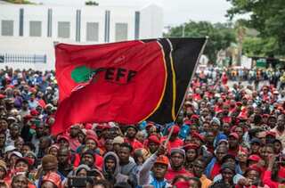 South African farmers in court for shoving black man into coffin