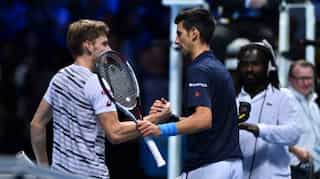 Tour Finals: Djokovic beats Goffin in straight sets to keep pressure on Murray