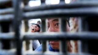 In pictures: After 20 years, 3 minutes to embrace on US-Mexico border