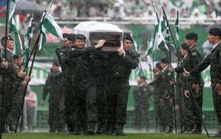 In pouring rain, Brazil town mourns fallen football team