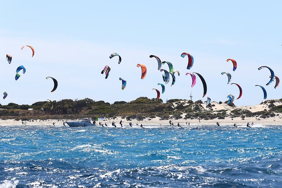 Competitors cross the start line at Rottnest Island during the Red Bull Lighthouse