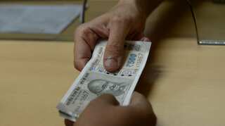 India lowers interest on employees' provident fund deposits