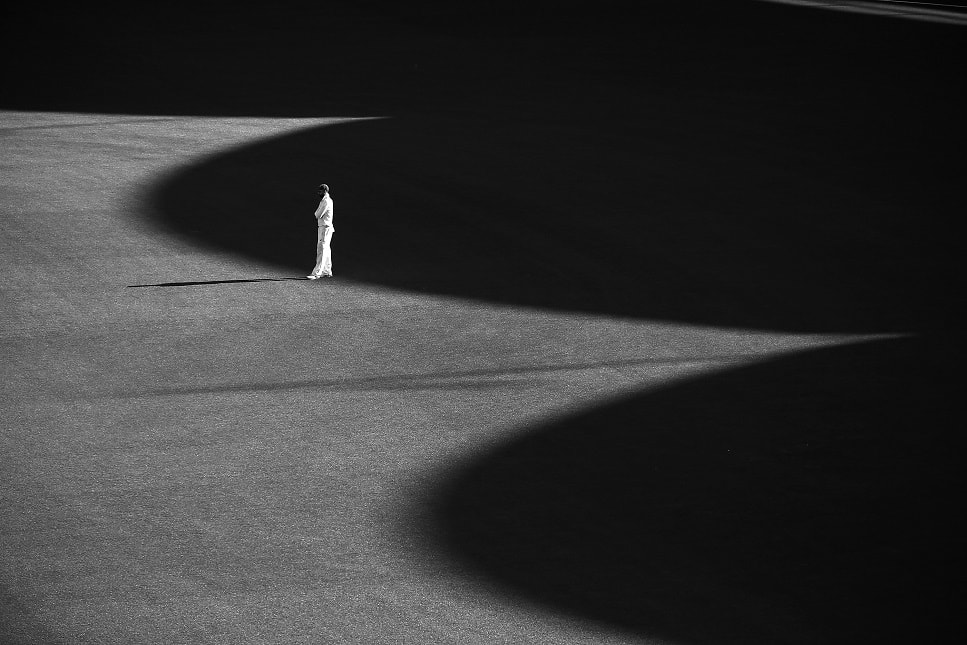 Nathan Lyon of the NSW Blues stands in the outfield during day two of the Sheffield Shield match