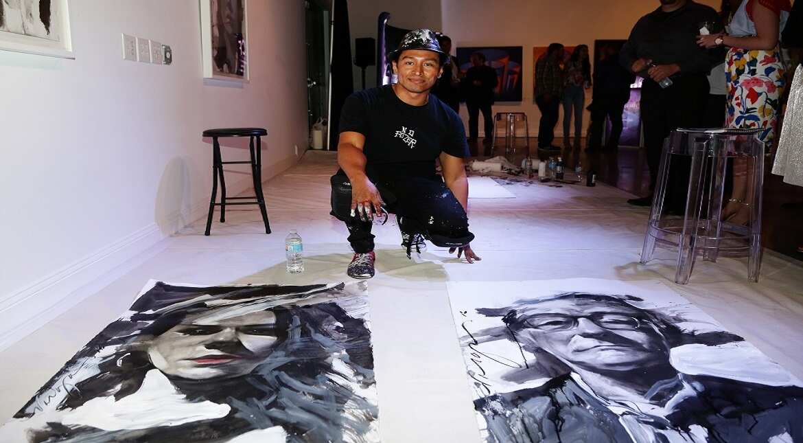 Artist Robert Vargas live paints at Lexus Presents Obras de Arte at MANA Garage in Miami, Florida.