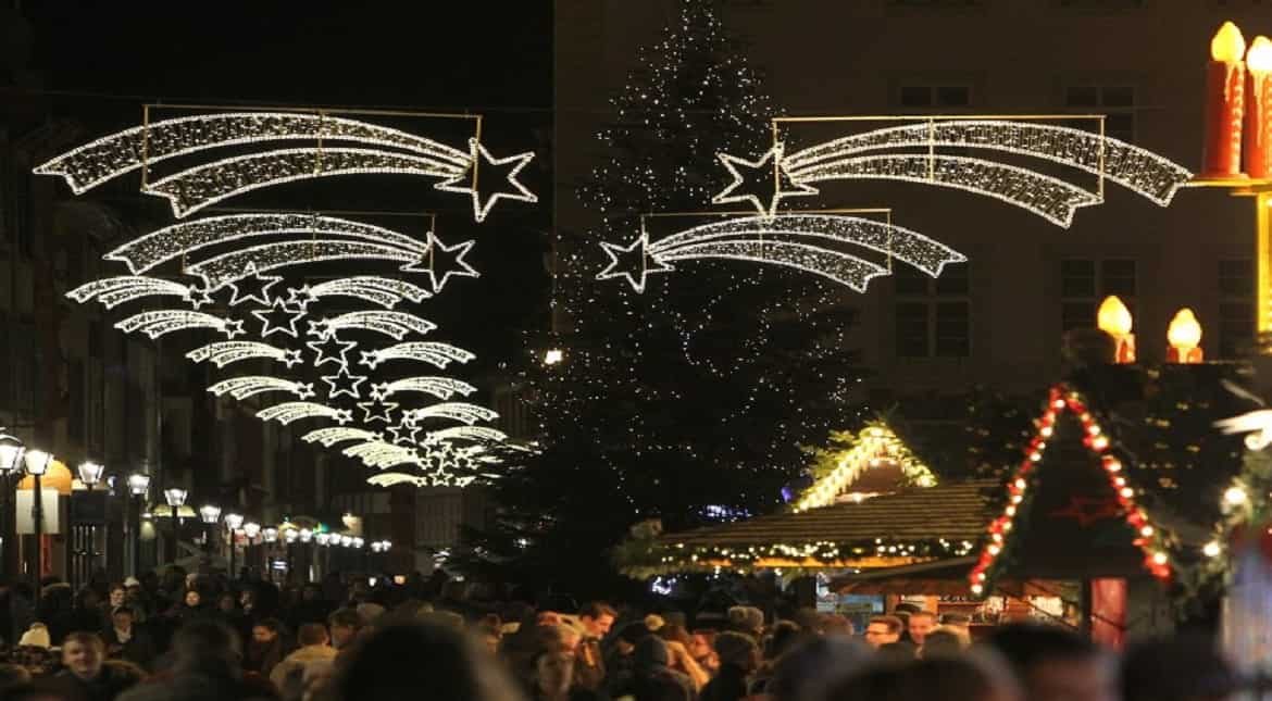 Visitors are pictured at the Christmas market in Heidelberg, southern Germany