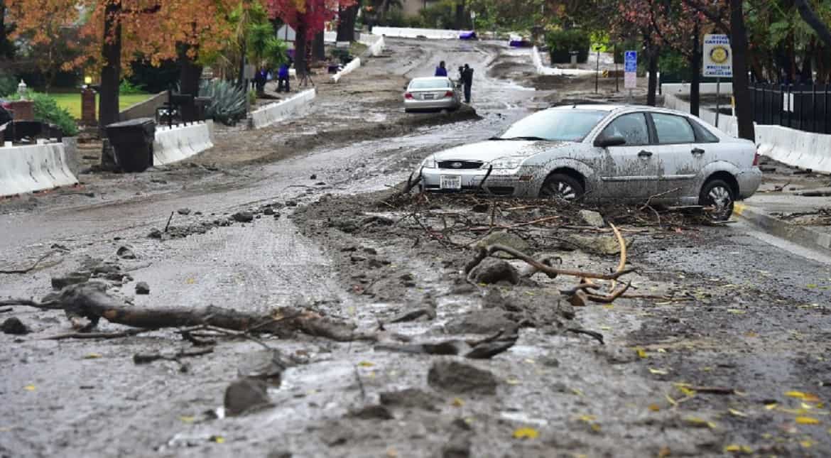 A vehicle seen stuck in the mud which flowed down Melcanyon Road in Duarte, California