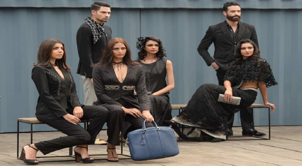 Models present creations by Indian fashion designer Ravi Bajaj during a show to launch the new BMW Mini Clubman car in Mumbai.