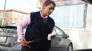 Women at wheel of 'pink taxis' challenge Jordan norms